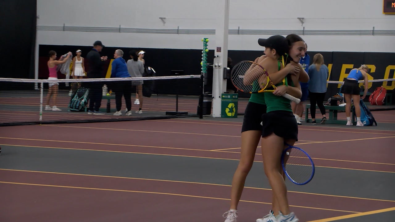Rochester Mayo tennis team celebrating their victory at the state championships