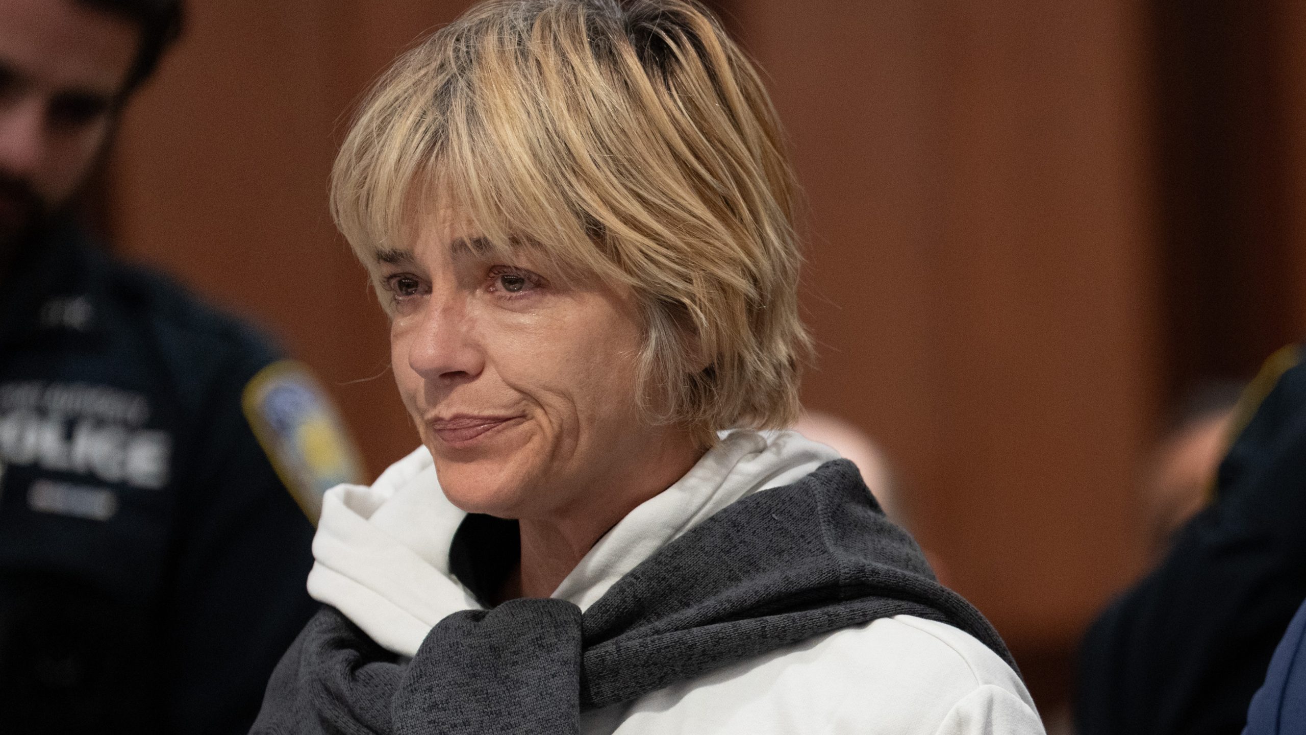 Selma Blair on a Delta flight, looking distressed.
